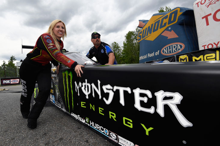 Courtney Force pushing her sister's car