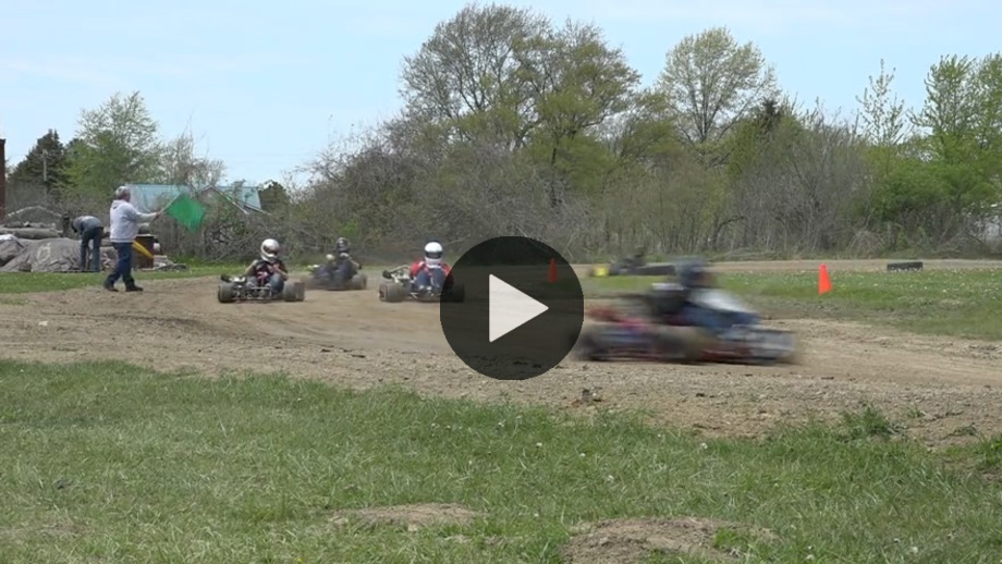NHRA drag racers turn corners in the dirt on backyard go-kart track in ...