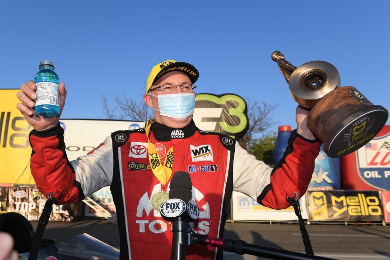 Doug Kalitta pilots his Top Fuel dragster past Steve Torrence in final