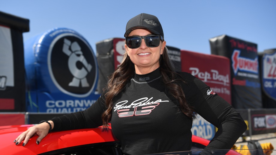 Erica Enders standing next to her car