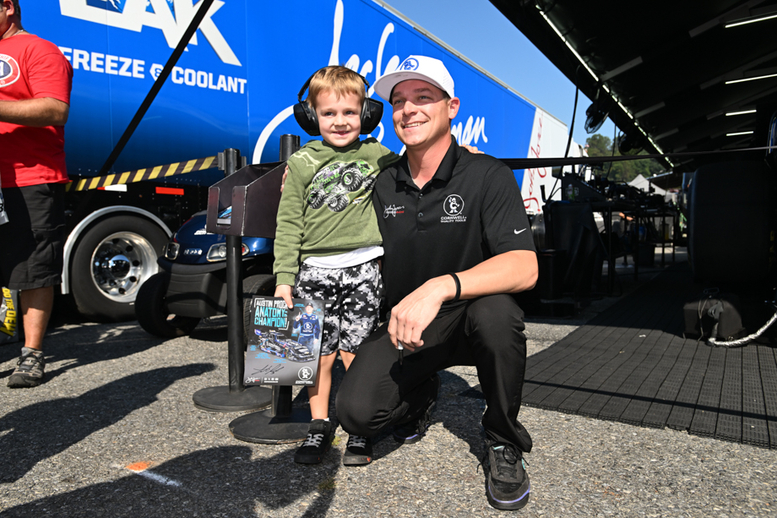 Austin Prock with a drag racing fan