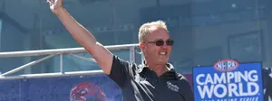 Top Alcohol Dragster driver Duane Shields waves to crowd