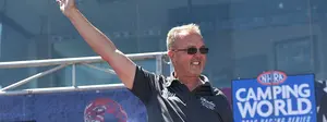 Top Alcohol Dragster driver Duane Shields waves to crowd