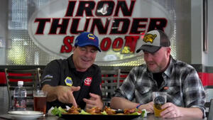 Ron Capps and Brian Lohnes crushed a plate of chicken wings in Charlotte