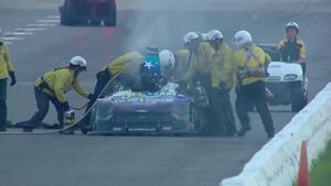 Tim Wilkerson blows the body off his Ford Mustang during Funny Car qualifying
