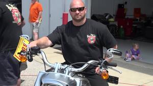 Mike Salinas gives his crew Harley-Davidson motorcycles following first career win