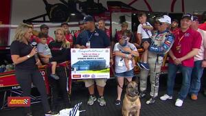 Advance Auto Parts and Homes for Heroes present Army Specialist Andrew Brown with a mortgage-free home